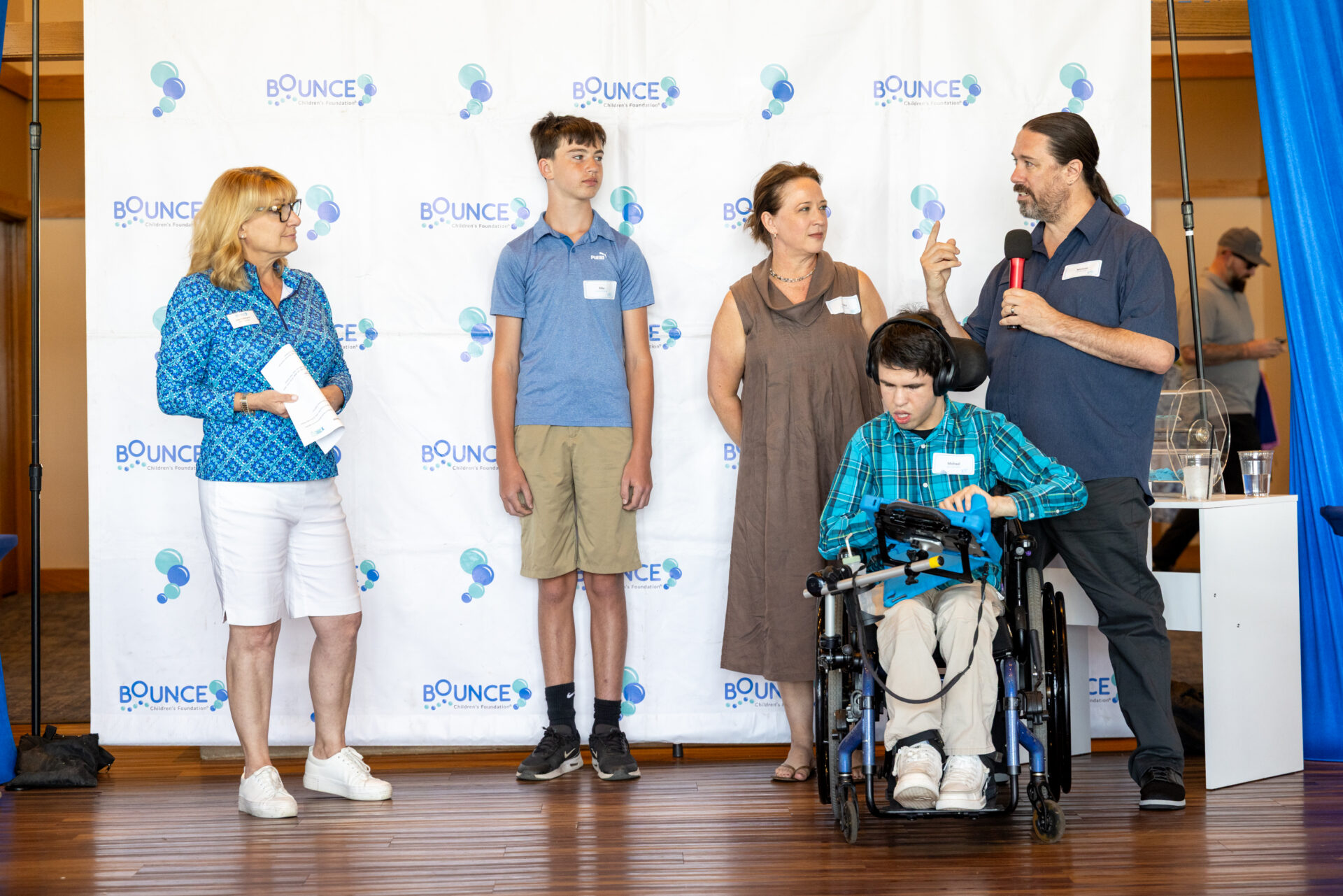 A Bounce family shares their story on stage at Birdies Fore Bounce 2026